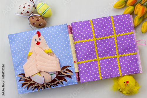 Handmade textile book for baby. Easter present for baby. Pages with felt eggs, birds and rabbits. Woolly toys on a string. Baby development. Educational toys. Fine motor skills.