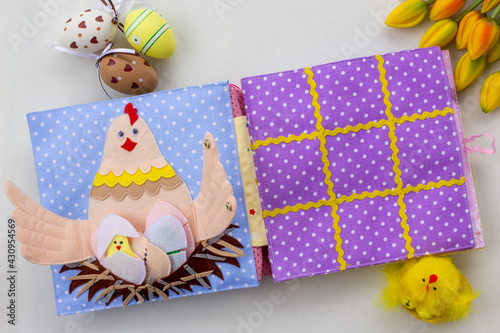 Handmade textile book for baby. Easter present for baby. Pages with felt eggs, birds and rabbits. Woolly toys on a string. Baby development. Educational toys. Fine motor skills.