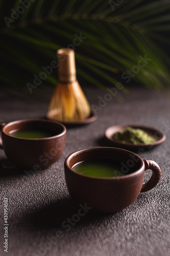 Matcha green tea in a ceramic mugs