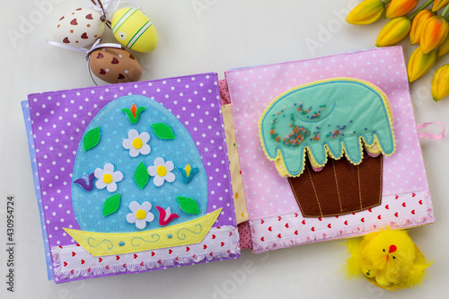 Handmade textile book for baby. Easter present for baby. Pages with felt eggs, birds and rabbits. Woolly toys on a string. Baby development. Educational toys. Fine motor skills.