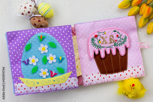Handmade textile book for baby. Easter present for baby. Pages with felt eggs, birds and rabbits. Woolly toys on a string. Baby development. Educational toys. Fine motor skills.