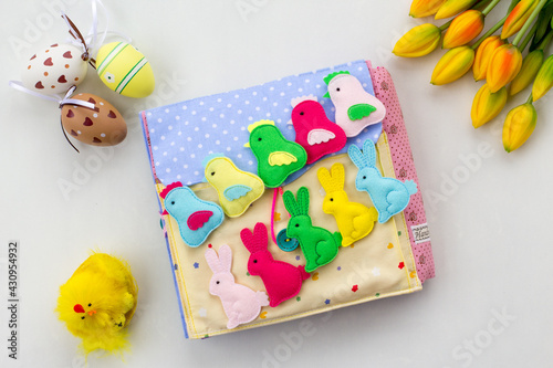 Handmade textile book for baby. Easter present for baby. Pages with felt eggs, birds and rabbits. Woolly toys on a string. Baby development. Educational toys. Fine motor skills.