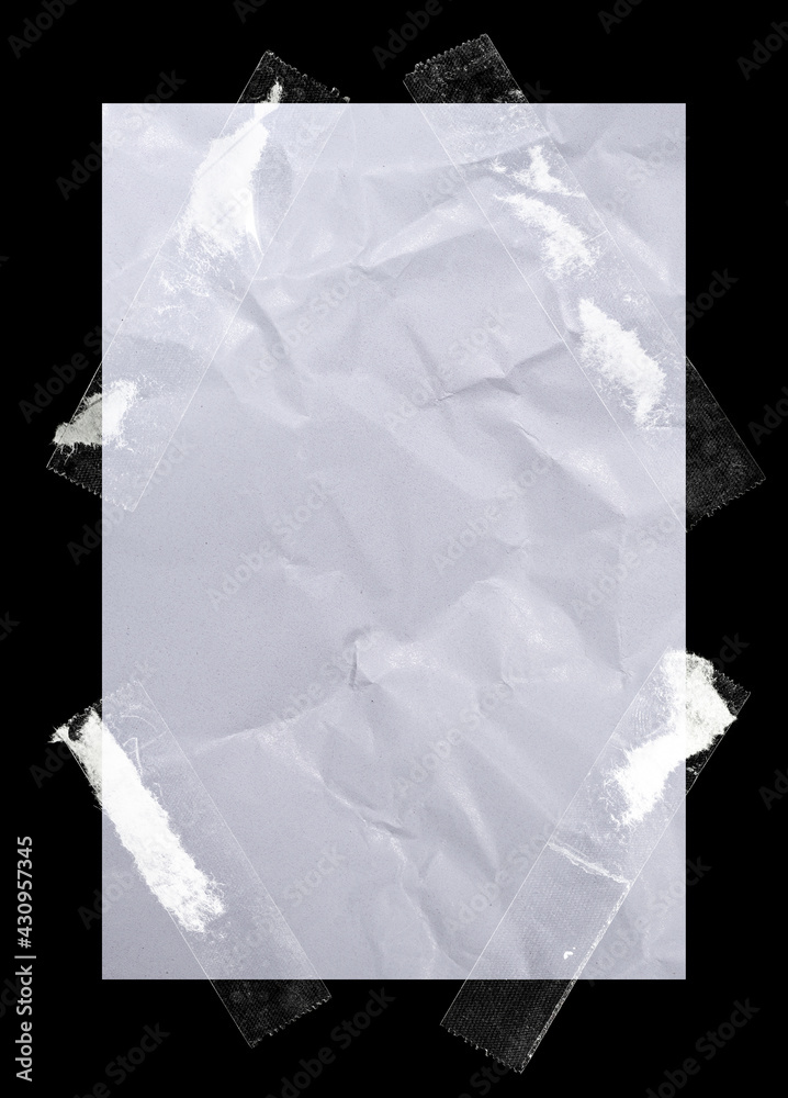 white paper fixed by four transparent sticker on black background.