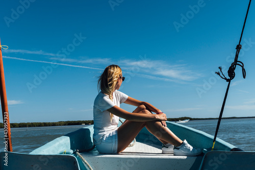 Middle aged woman and swim suit travelling in motorboat on sunny day at caribbean, Travel, Mexico, Lifestyle, quality of life, Deceleration
