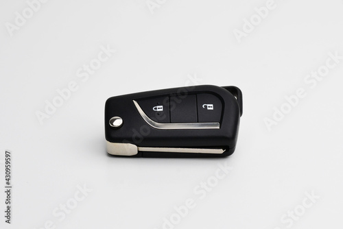 Car key on white isolated. Remote control alarm system. Rental car service business. The ignition key from the car. Close up car key fob. 