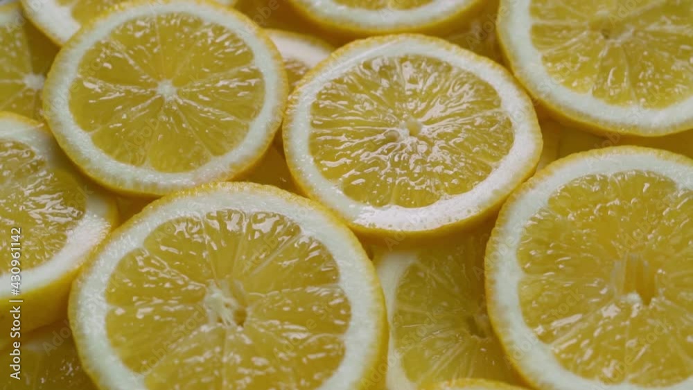 Lemon Slices, Macro, Rotate. Citrus fruits. Isolated Background of Sliced Lemon Slices. Healthy Vegan Food. Lemon Slices, Macro, Rotate. Citrus fruits. Isolated Background of Sliced Lemon Slices. Healthy Vegan Food.