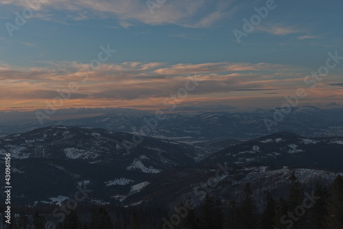 Sunset in the mountains. Colorful sky during the sunset. Winter Beskid Żywiecki.