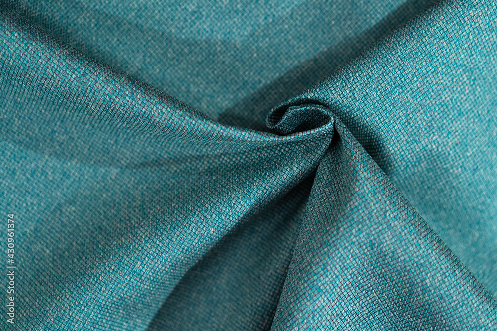 Luxury turquoise fabric sample close-up. Can be used as background. Luxury turquoise fabric sample close-up. Can be used as background.