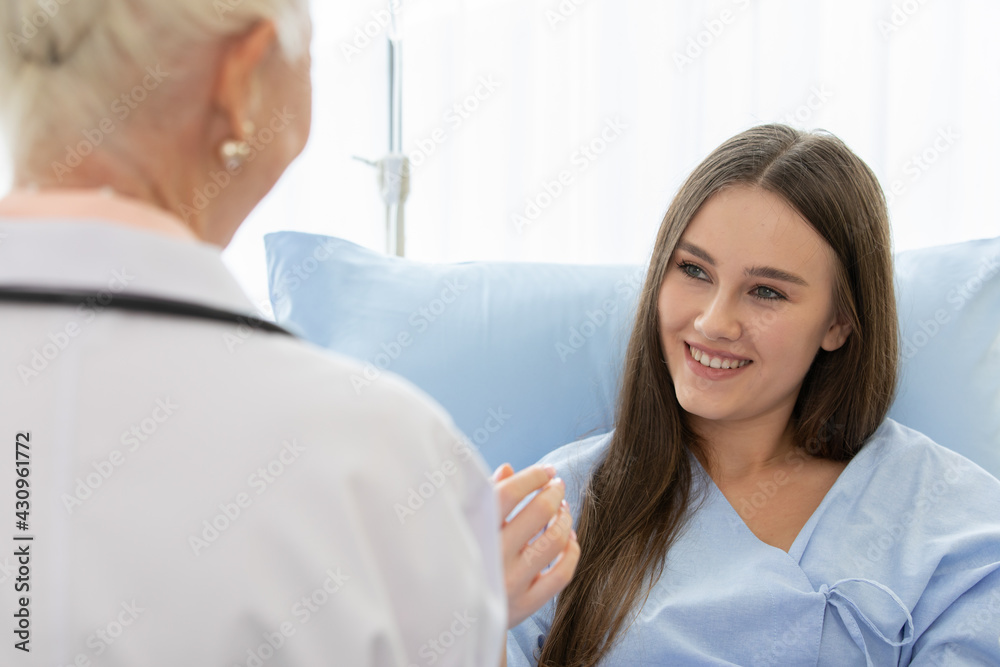 Fototapeta premium Senior older female doctor visit the patient room and make a history taking for diagnosis and cure process