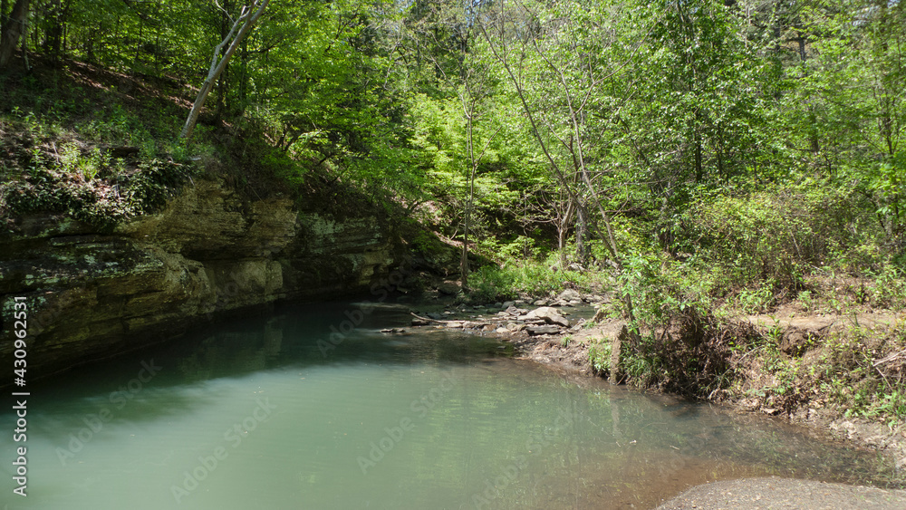 Crack in the rock trail, Van Buren, Arkansas, mountain stream with blue green water Crack in the rock trail, Van Buren, Arkansas, mountain stream with blue green water