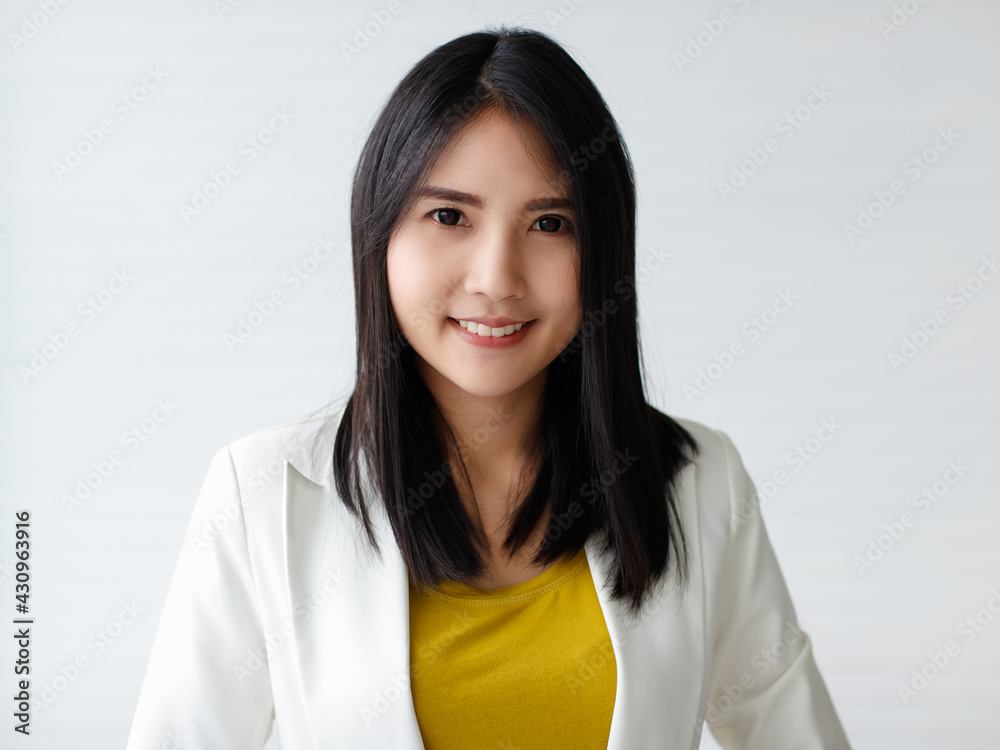 Cute happy cheerful young woman with straight black long hair, looking at camera with a joyful and charming smile while feeling happy and carefree positive thinking Cute happy cheerful young woman with straight black long hair, looking at camera with a joyful and charming smile while feeling happy and carefree positive thinking