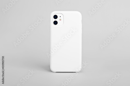 White iphone 11 isolated on gray background, phone case mock up, smart phone back view