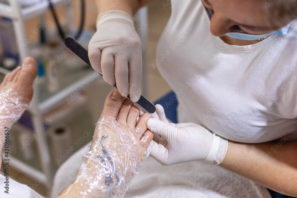 Female foot in process of pedicure procedure stock photo Female foot in process of pedicure procedure stock photo