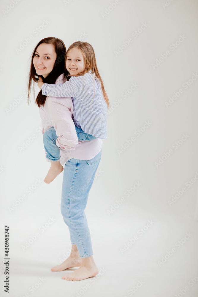 Mom and daughter play and have fun. beautiful happy family Mom and daughter play and have fun. beautiful happy family