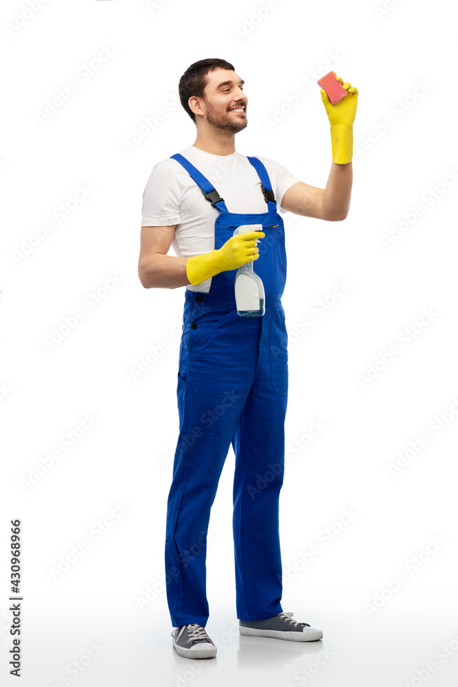 profession, cleaning service and people - happy smiling male worker or cleaner in overall and gloves with sponge and detergent over white background profession, cleaning service and people - happy smiling male worker or cleaner in overall and gloves with sponge and detergent over white background