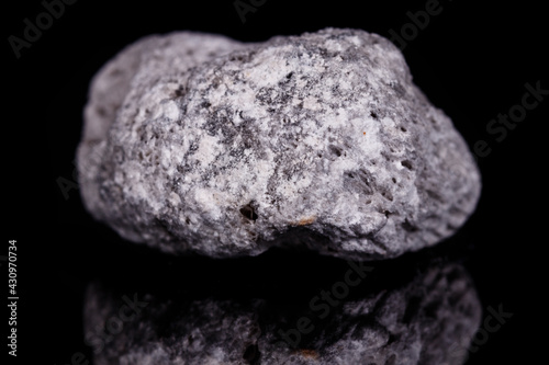 Macro mineral stone Pumice on black background © Minakryn Ruslan 