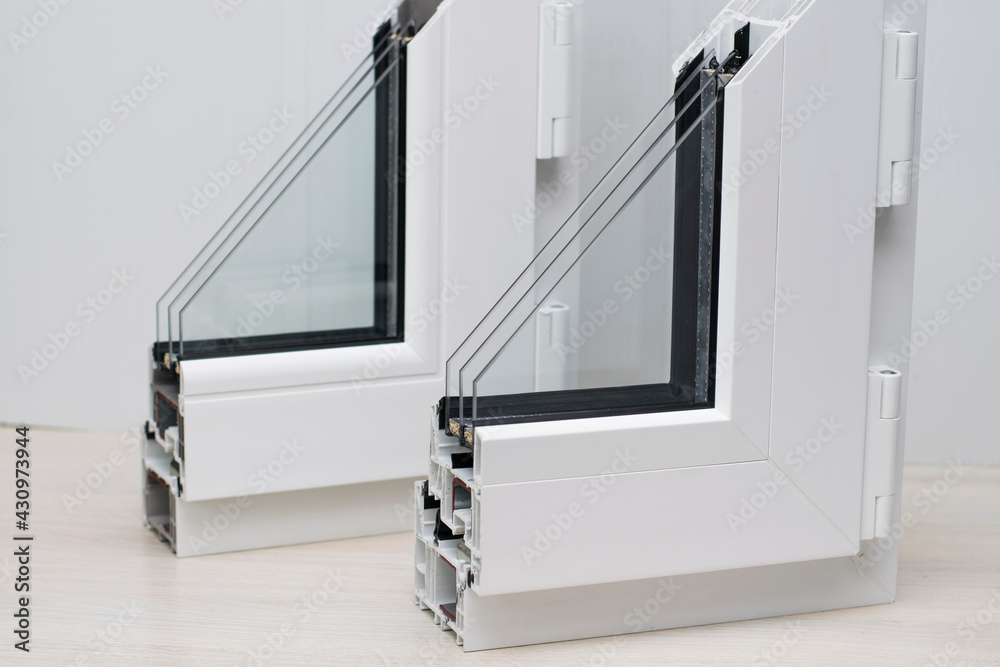Samples of plastic windows in a section. PVC window profiles and double ...