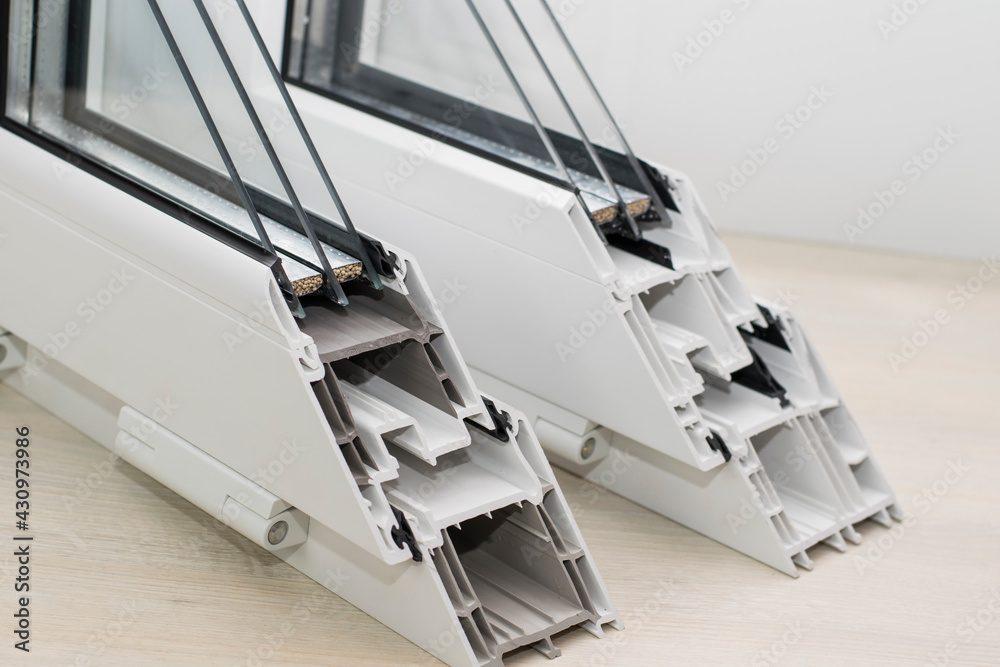 Samples of sections of pvc window profiles and double-glazed windows ...
