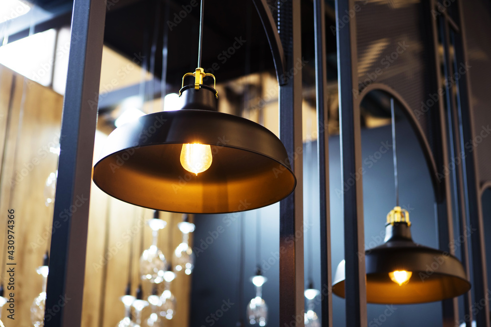 Metal chandeliers in the interior of the kitchen. Retro style lamps with large lampshade. Close-up Metal chandeliers in the interior of the kitchen. Retro style lamps with large lampshade. Close-up