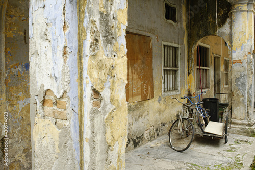 decrepit wall and abandoned house in Panglima Lane or Concubine Lane, famous heritage in the old town of Ipoh, Perak, malaysia