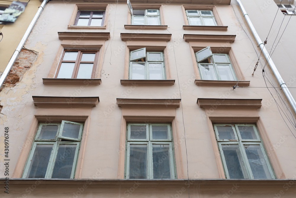 Cozy building facade with windows in the city