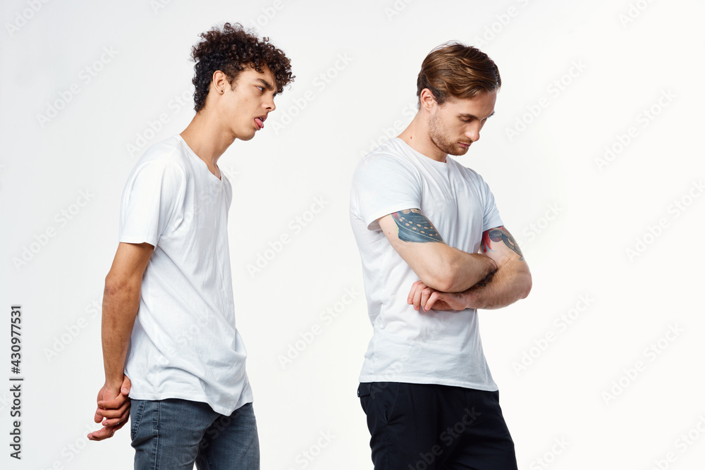 two men in white t-shirts gesturing with their hands Friendship Studio two men in white t-shirts gesturing with their hands Friendship Studio