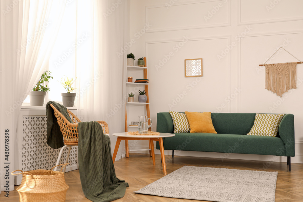 Stylish living room interior with comfortable sofa and small table  Stock-Foto | Adobe Stock