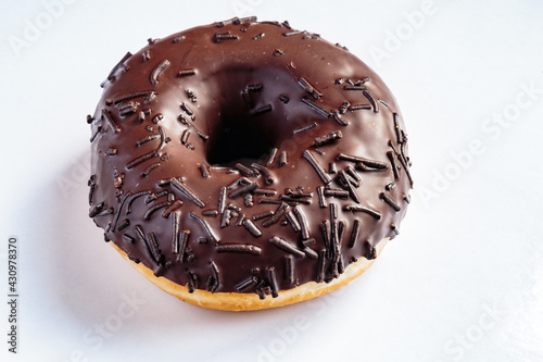 Tasty glazed chocolate donut with cream.