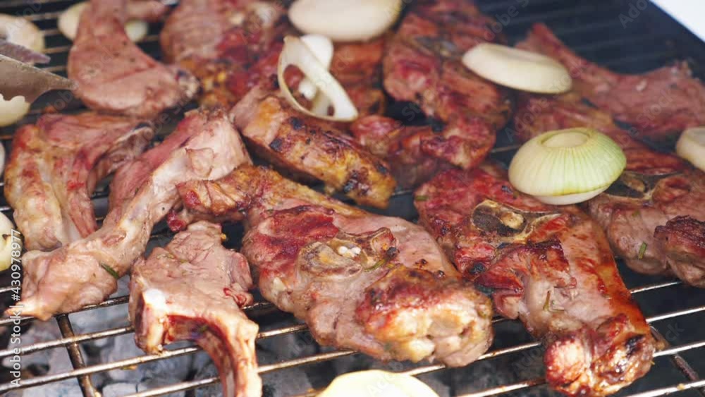 Roasted delicious meat on the grill in slow motion 180fps Roasted delicious meat on the grill in slow motion 180fps