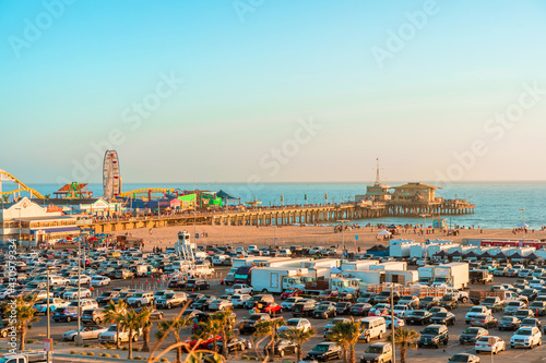 Panoramic views of Santa Monica and the beach at sunset, and fully filled parking on the weekend. Los Angeles, USA - 15 Apr 2021