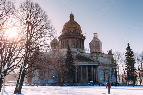 Snow-covered Park in front of St. Isaac's Cathedral in St. Petersburg in the spring sun