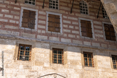 Facades of ancient buildings in Istanbul city on the background of blue sky on a sunny summer day, public places photo