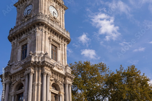 Facades of ancient buildings in Istanbul city on the background of blue sky on a sunny summer day, public places photo