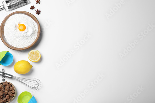 Cooking utensils and ingredients on light background, flat lay. Space for text