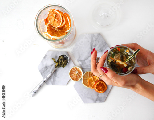 dried fruit in a jar and on the table. vegetarianism and healthy eating. energy for all time from healthy food. beautiful fruits in jars. weight loss. orange white glass. High quality photo
