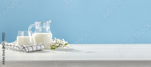 Fresh milk on white desk and blue background. 