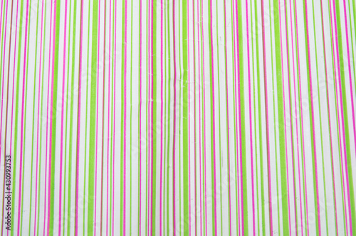 colorful striped wrapping paper for gifts. bright texture of vertical stripes closeup