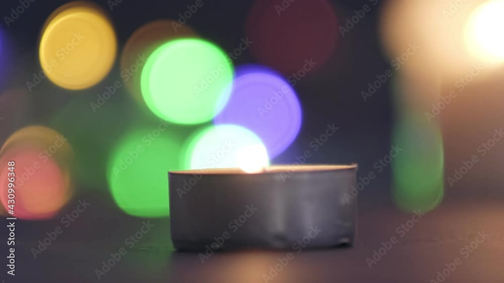 candle in the dark, candle position on the left of the frame. Cozy home