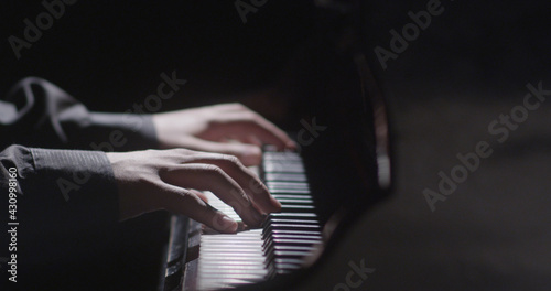 Piano music pianist hands playing. Musical instrument grand piano details 4K