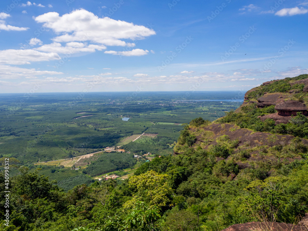 The beautiful top of the big rock on a mountain, blue sky, and the forest in Unseen Thailand of Phu Langka National Park, Nong Khai, Thailand. The beautiful top of the big rock on a mountain, blue sky, and the forest in Unseen Thailand of Phu Langka National Park, Nong Khai, Thailand.