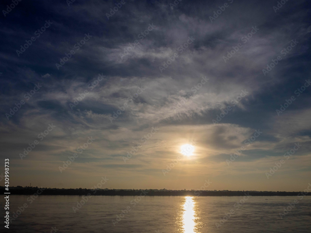 At sunset, the Mekong River.