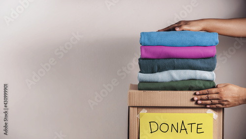 Clothes Donation, Renewable Concept.Box of Use Old Cloth. Preparing Garment at Home before Donate photo