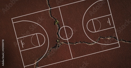 Composition of basketball court over brown cracked distressed surface