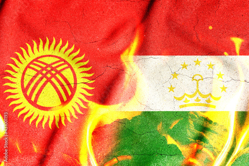 Canvas Print Conceptual photo with the flags of Tajikistan and Kyrgyzstan during the aggravation of relations between them