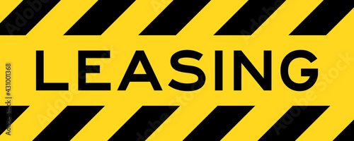 Yellow and black color with line striped label banner with word leasing