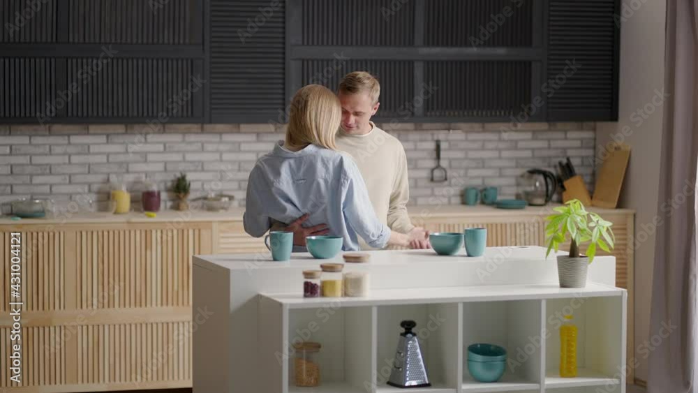 Happy Cheerful Couple Dancing On Kitchen While Cooking Together. Happy Cheerful Couple Dancing On Kitchen While Cooking Together.