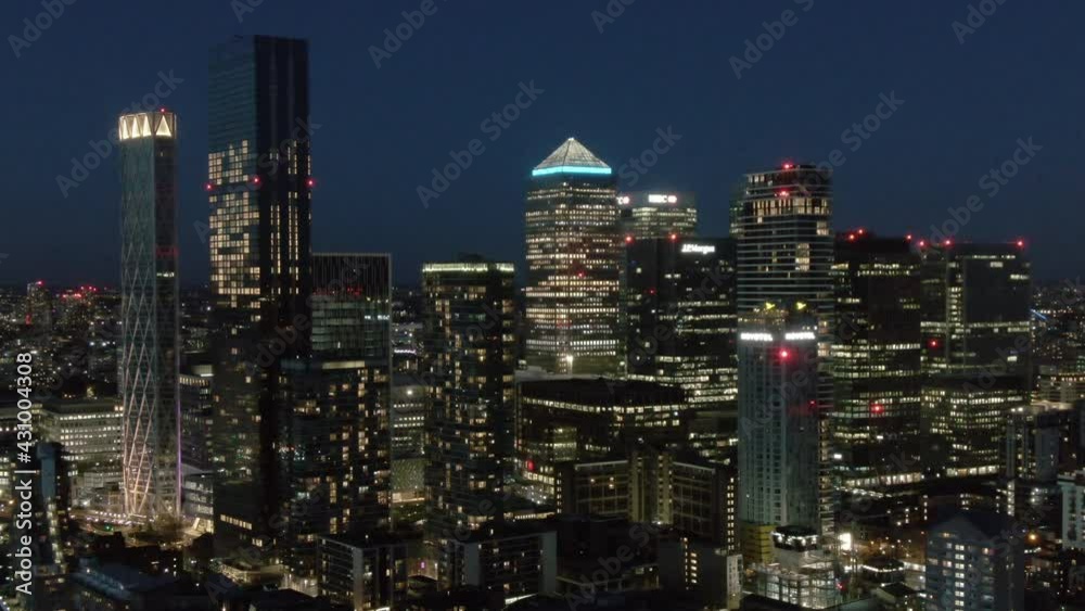 Downtown skyscrapers illuminated at night, London, UK Downtown skyscrapers illuminated at night, London, UK