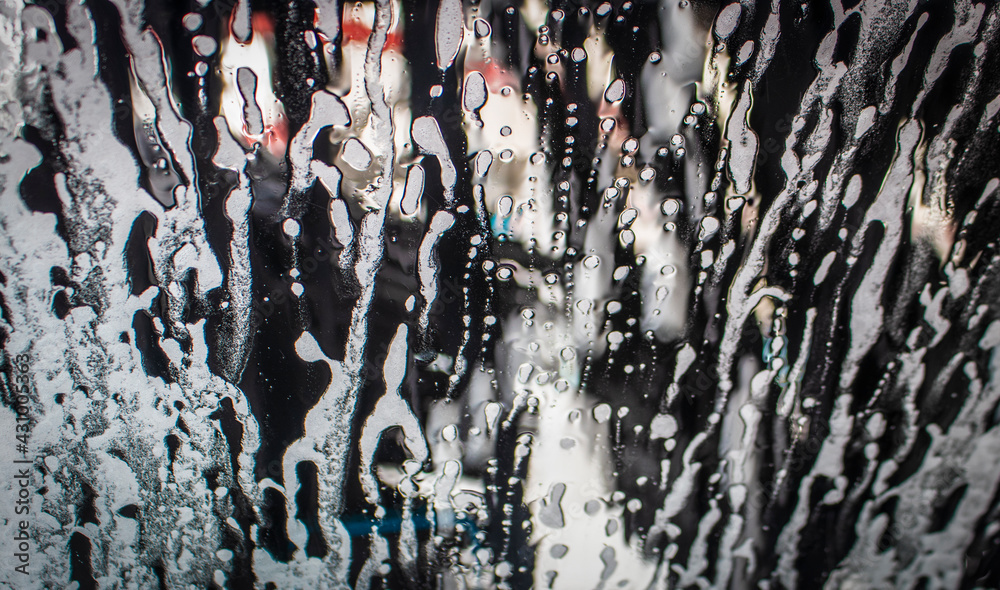 Background - Going through an automatic car wash - soapy water