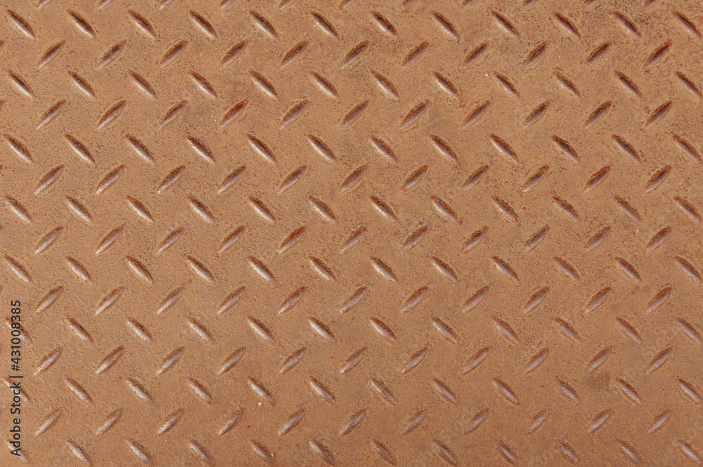 Top view of Slightly rusted steel diamond pattern sheet as background. Top view of Slightly rusted steel diamond pattern sheet as background.