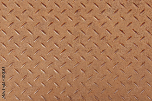 Top view of Slightly rusted steel diamond pattern sheet as background.